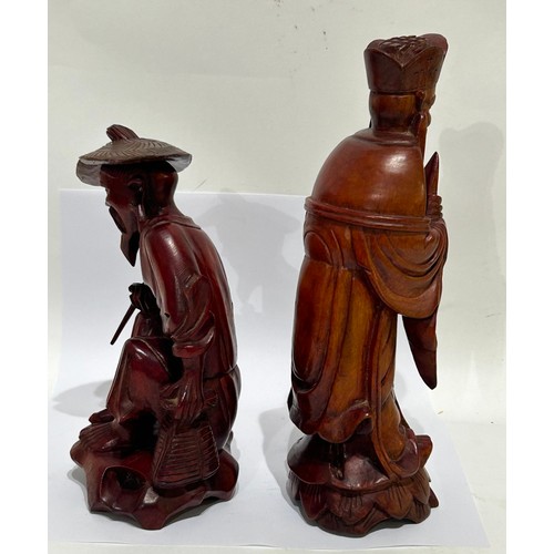 201 - Two Asian/Japanese carved wooden Figures. One with removable hat. Tallest measuring 20cm high, other... 