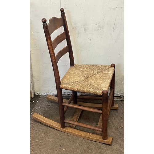 455 - Antique Ladder Back Rocking Chair With With Rush Seat.