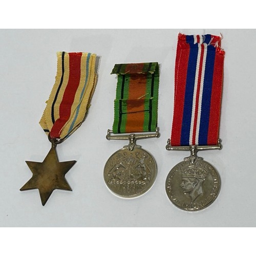 124 - A Group of full sized WW2 Medals, to include The Africa star and bar , 1939-1945 medal and A defence... 