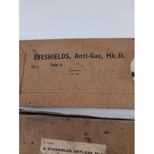 320 - Anti Gas Eye Shields and a Douglas combined Protractor & Parallel Rule