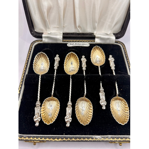 9A - Six Decorative Twisted Silver Hallmarked Tea Spoons Displaying Figures At Ends in Case. 10cm x 2cm, ... 