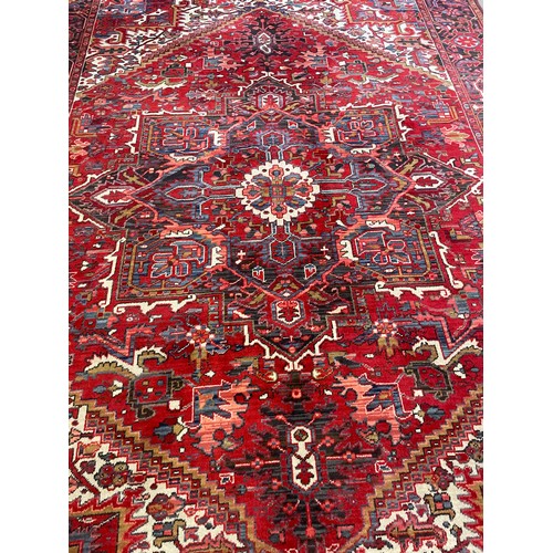 443 - Extra Large Decorative Ground Heriz Rug. 337 x 237 cms