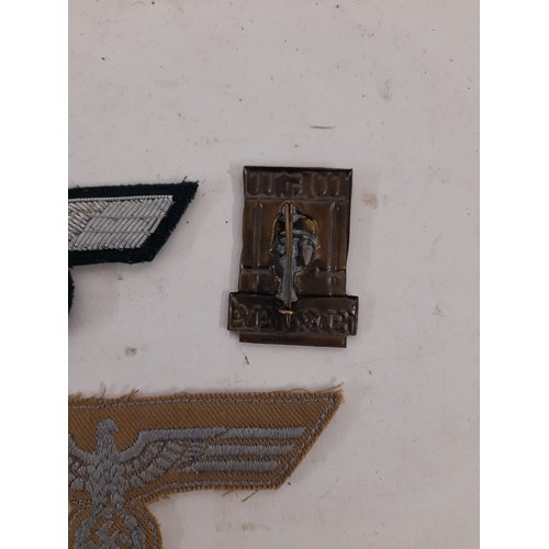 367 - WW2 Style German Insignia, 2 cloth and one metal badge.    (3)