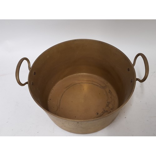 277 - Heavy Brass 2 Handle cooking pot 29cm x 14cm and a heavy copper pot 21cm x 11cm