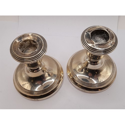 548 - Pair of Silver Hallmarked Candlesticks with weighted bases, 9.5cm high total weight 445.7 grams