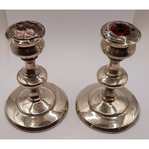 549 - Pair of Silver Hallmarked Candlesticks with weighted bases, 14cm high, total weight 712.8grams