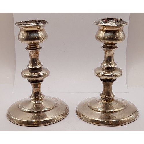 549 - Pair of Silver Hallmarked Candlesticks with weighted bases, 14cm high, total weight 712.8grams