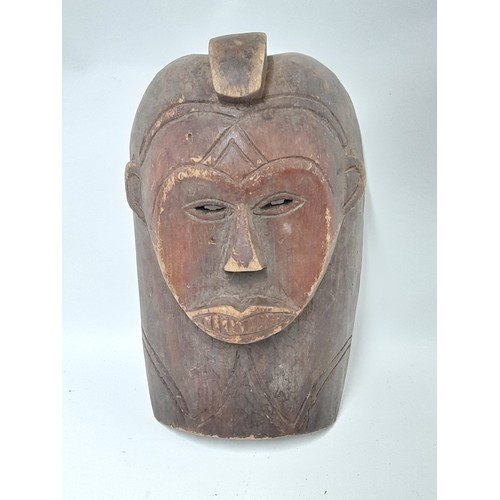 151 - Tribal Mask, Hand Carved wood with brown face and carved detail, 34cm x 23cm