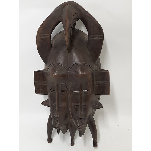 152 - Tribal Mask, Small Heavy Carved wood double face mask with carved birds head on top, 34cm x 18cm