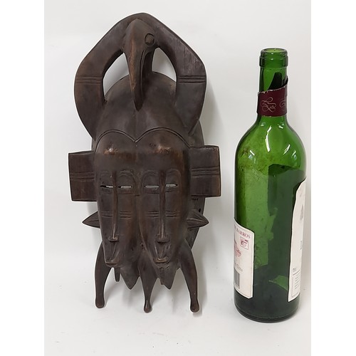 152 - Tribal Mask, Small Heavy Carved wood double face mask with carved birds head on top, 34cm x 18cm