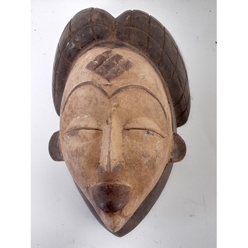 154 - Tribal Punu Mask, White painted Face carved wood mask with carved detail to forehead, 31cm x 19cm