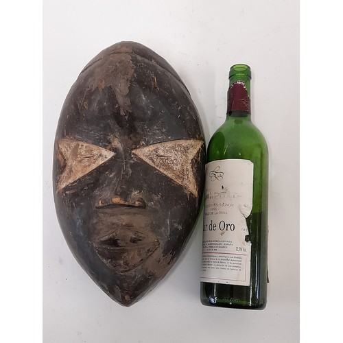 161 - Tribal Mask, Black Face carved Mask with white eyes, 31cm x 20cm