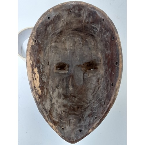 161 - Tribal Mask, Black Face carved Mask with white eyes, 31cm x 20cm