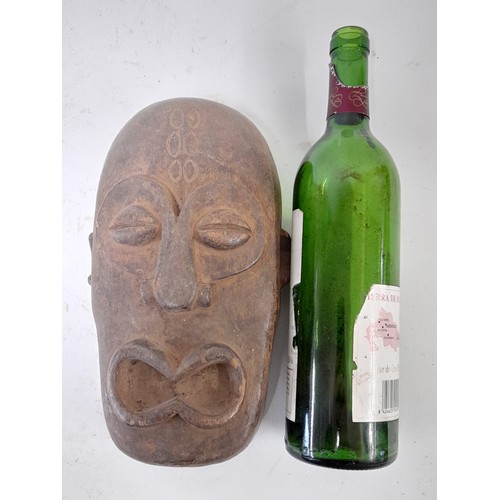 176 - Tribal Mask, Small heavy Carved wood mask, 25cm x 15cm