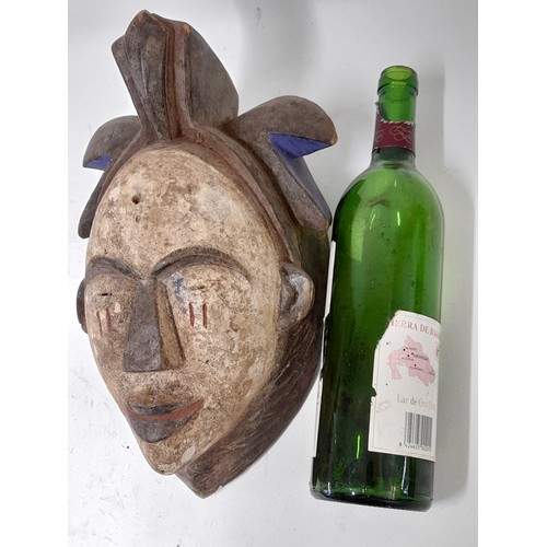 177 - Tribal Mask, Carved wood mask with White face and red painted scars to cheeks, 33cm x 21cm