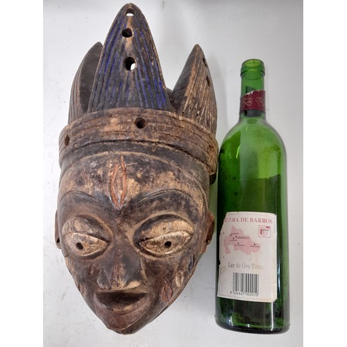 180 - Tribal Mask, Carved wood mask with carved head dress and white eyes, 31cm x 18cm