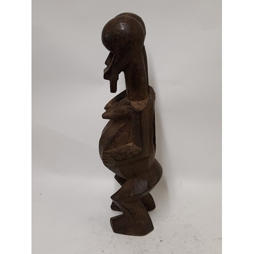 184 - Tribal Figure, 2 Headed Fetish figure with hollowed out stomach, 50cm high