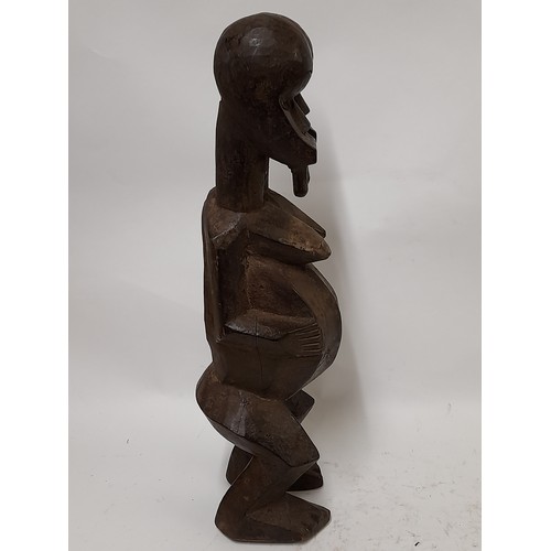 184 - Tribal Figure, 2 Headed Fetish figure with hollowed out stomach, 50cm high