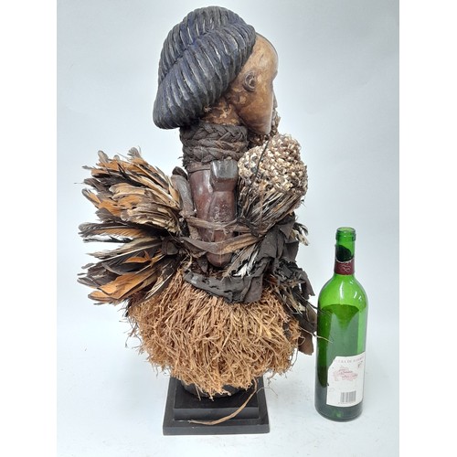 182 - Tribal Figure, Large Free Standing Fetish Female Figure with raffia and feathers, 63cm high