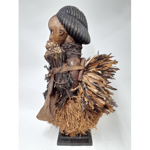 182 - Tribal Figure, Large Free Standing Fetish Female Figure with raffia and feathers, 63cm high