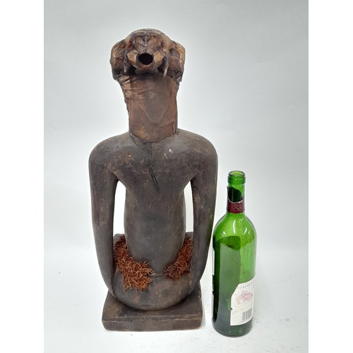 183 - Tribal Figure, Large free standing Fetish Female Figure with animal skull, 53cm high