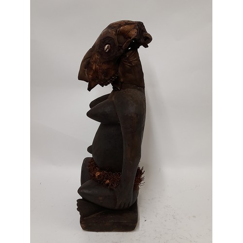 183 - Tribal Figure, Large free standing Fetish Female Figure with animal skull, 53cm high