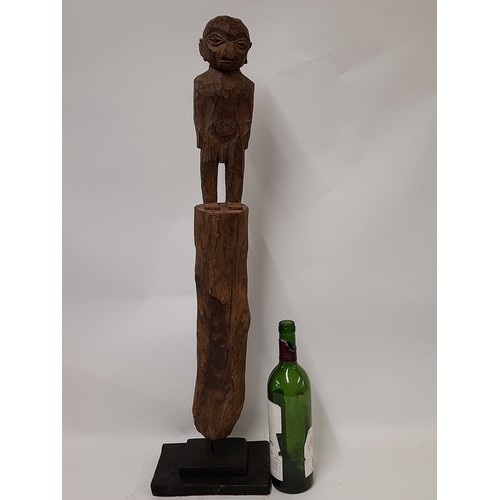 188 - Tribal Carved Figure mounted on a plinth, 80cm high