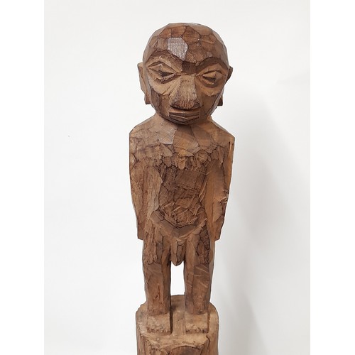 188 - Tribal Carved Figure mounted on a plinth, 80cm high