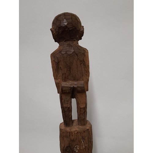 188 - Tribal Carved Figure mounted on a plinth, 80cm high