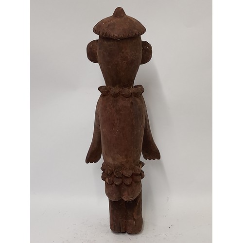 195 - Tribal Figure, Carved wood Figure with red/brown finish with carved decoration, 51cm high