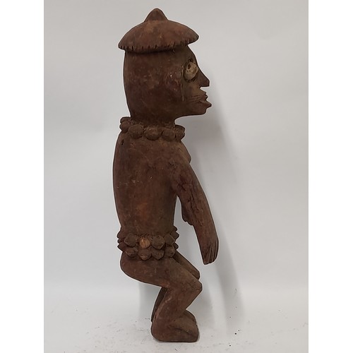 195 - Tribal Figure, Carved wood Figure with red/brown finish with carved decoration, 51cm high