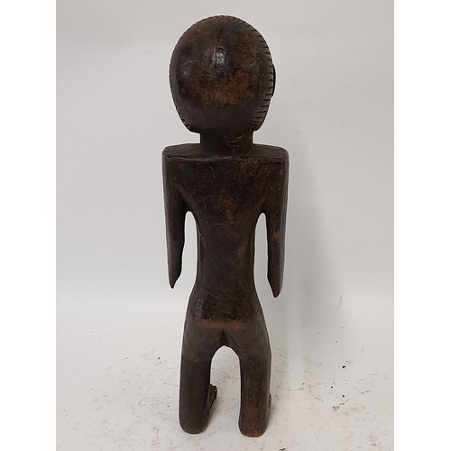 206 - Tribal Figure, Carved wood figure with carved decoration to head, 38cm high