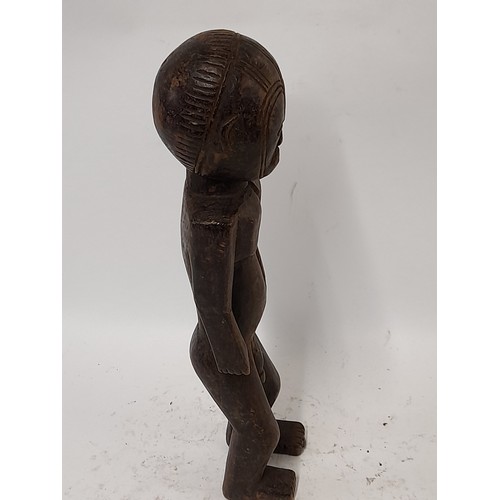 206 - Tribal Figure, Carved wood figure with carved decoration to head, 38cm high