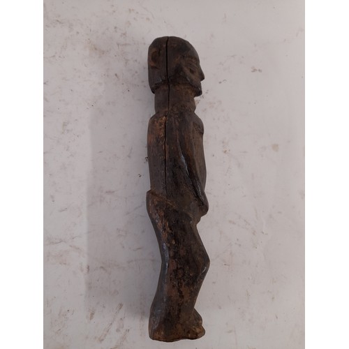 216 - Tribal Figure, Carved wood figure of a tribesman, 26cm high