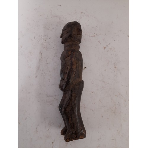 216 - Tribal Figure, Carved wood figure of a tribesman, 26cm high