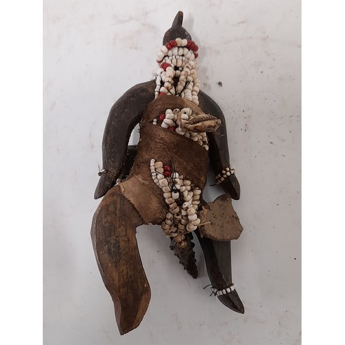 219 - Tribal Figure, Small Carved wood and cloth bound fetish figure with beads and hanging attachments, 1... 