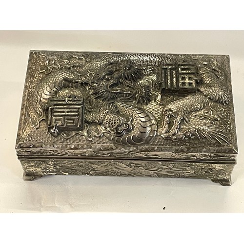 66 - White Metal Chinese Dragon And Bird Decorated Lidded Casket. 15 x 9 x 5.5 cms