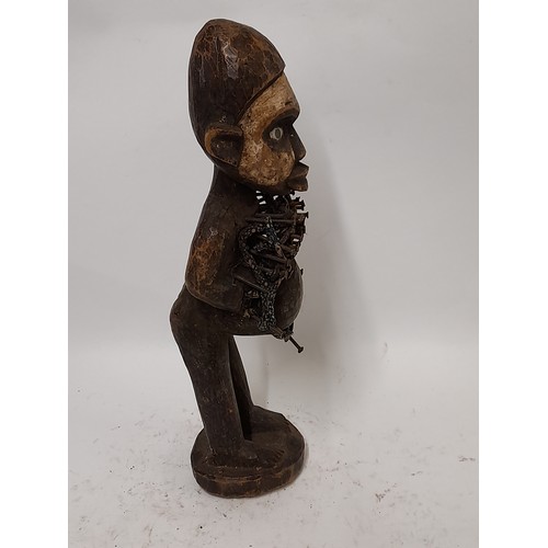 240 - Tribal Figure, Fetish Figure of a white faced figure with nails hammered into chest, 35cm high