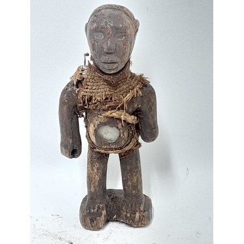 242 - Tribal Figure, Small Fetish Figure having bound body and glass window to stomach, 23cm high