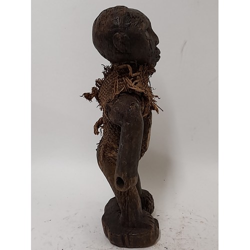 242 - Tribal Figure, Small Fetish Figure having bound body and glass window to stomach, 23cm high