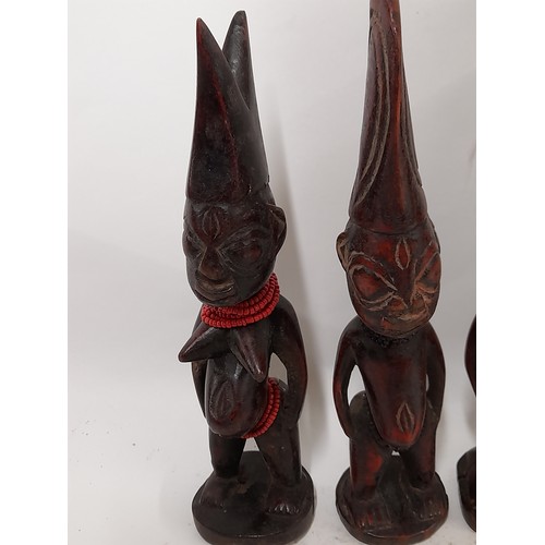 248 - 4 x Small carved wood Tribal figures, tallest 27cm high