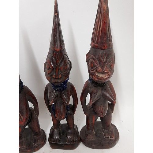 248 - 4 x Small carved wood Tribal figures, tallest 27cm high