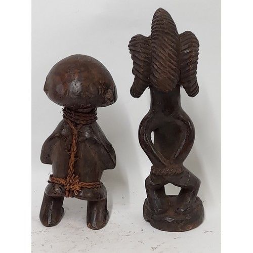 251 - 2 x Tribal Carved wood Figures, one with binding and the taller with carved bound hands behind back,... 