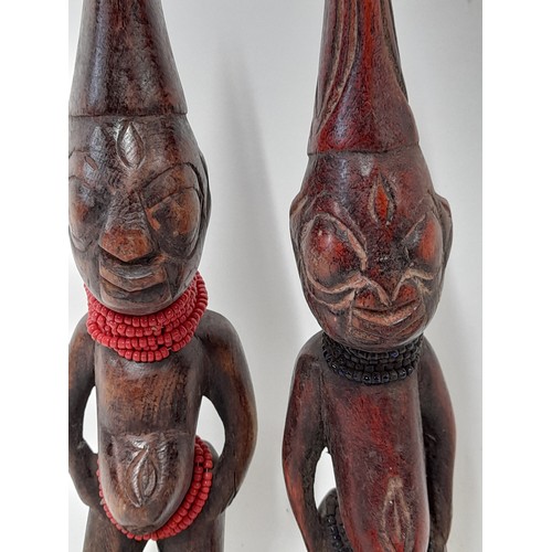 252 - 2 x carved wood Tribal Figures with Beads around their neck, 27cm tall