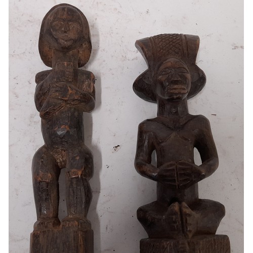 256 - 2 x carved wood Tribal Figures on Pedestal, longest 39cm