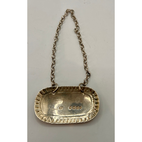 14 - Georgian Silver Hallmarked Brandy Bottle Neck Tag. 9cm x 5cm, 10.81Grams.