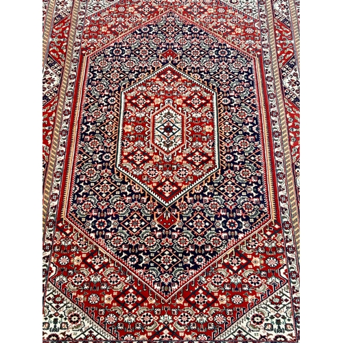 31 - Large Decorative Hand Made Rug. 245cm x 162cm.