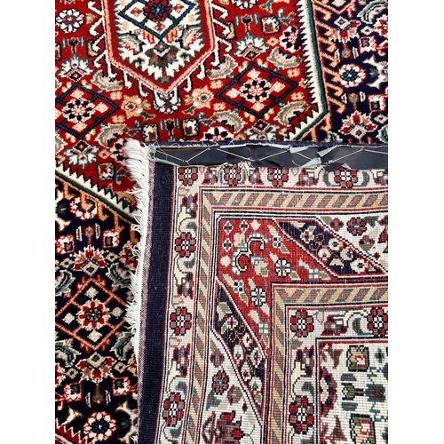 31 - Large Decorative Hand Made Rug. 245cm x 162cm.