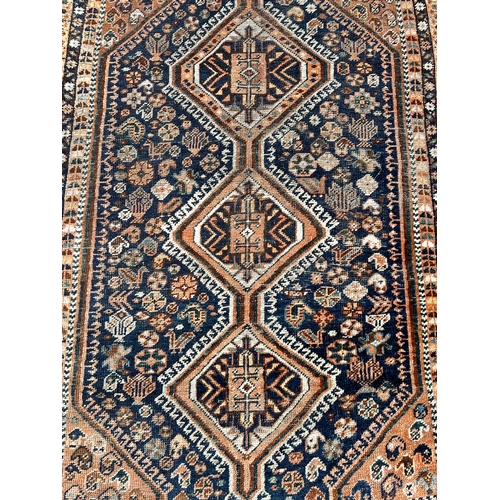 32 - Decorative Hand Made Rug. 149cm x 106cm.