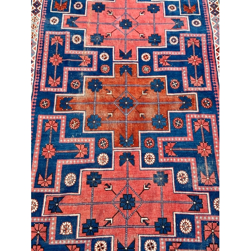 37 - Decorative Hand Made Rug. 159cm x 103cm.